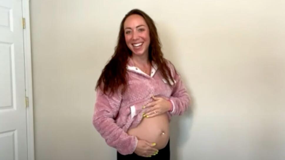 Deb Oliviara showing her stomach