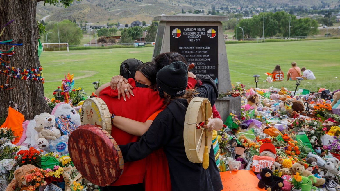 Tributes in front of the former Kamloops Residential School continue as the country grieves the 215 bodies of Indigenous children buried in a mass grave.