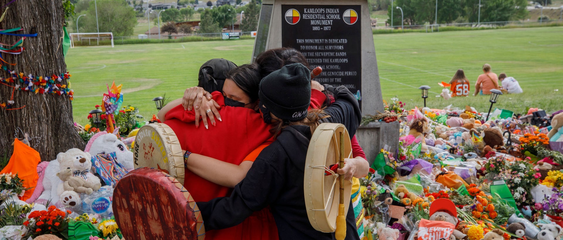 Tributes in front of the former Kamloops Residential School continue as the country grieves the 215 bodies of Indigenous children buried in a mass grave.