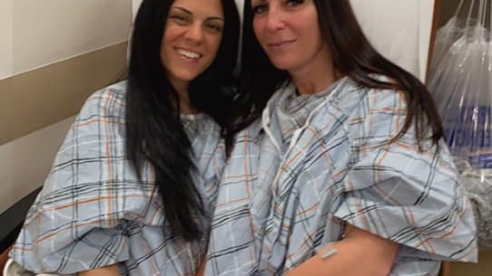 Lalima and Figueroa after surgery in hospital bed