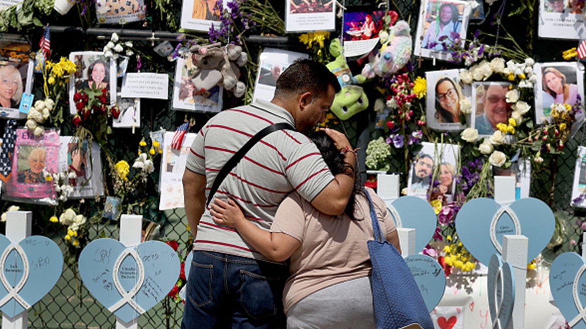 Recovery mission begins as mourners pray and weep at makeshift memorial.