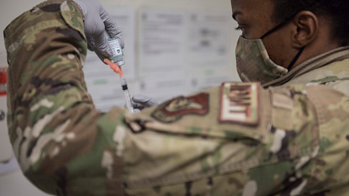 .S. Air Force Technical Sgt. Alexisa Humphrey prepares to administer the Moderna COVID-19 vaccine at Kunsan Air Base on December 29, 2020 in Kunsan, South Korea.