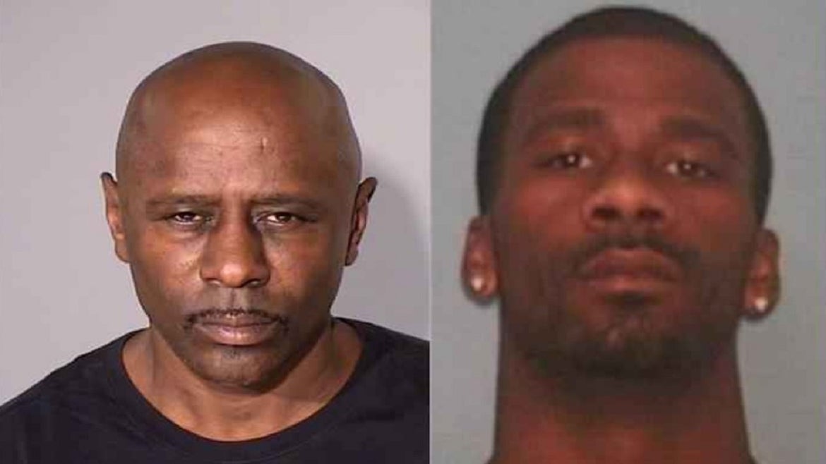 A father and son have been charged in connection with a quadruple homicide.