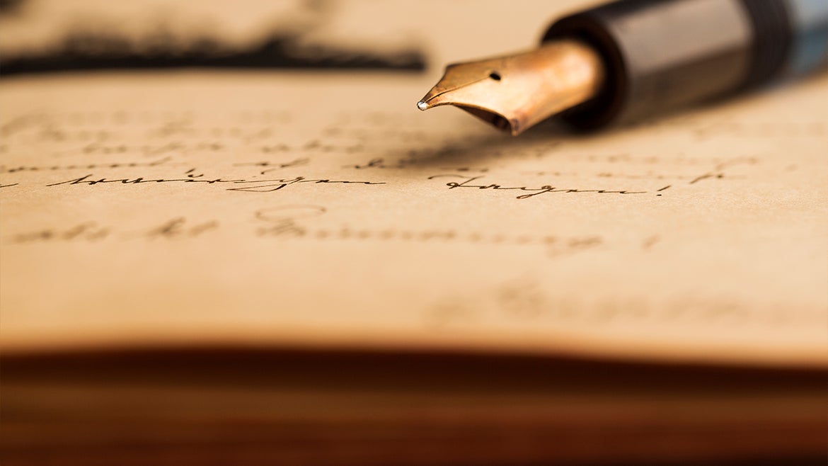 A stock image of a vintage letter and fountain pen.
