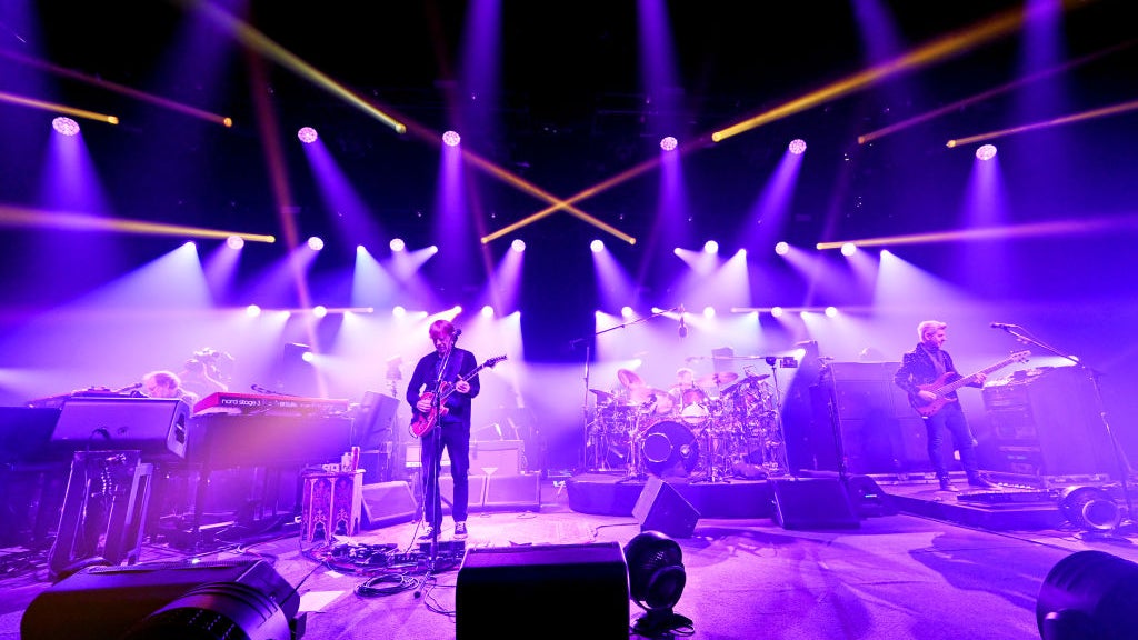 Phish in concert with purple lens