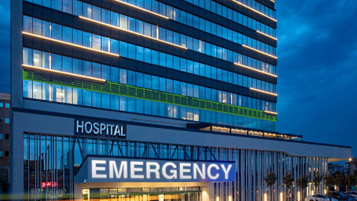 A stock image of the exterior of a hospital building. 