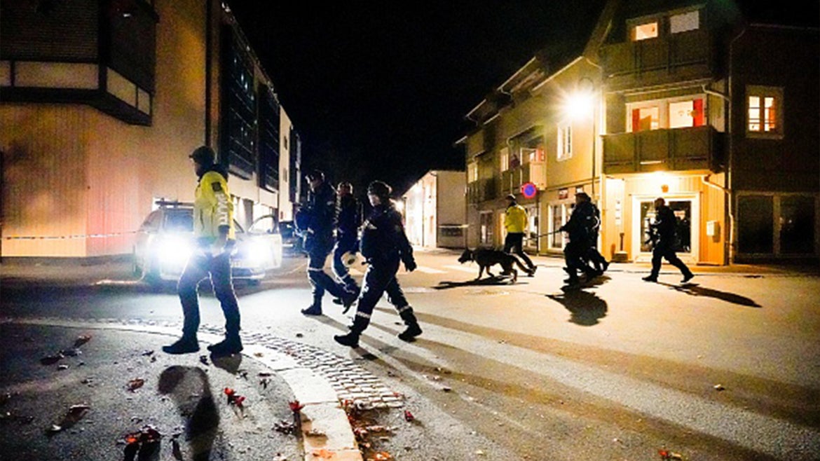 Police officers cordon off the scene where they are investigating in Kongsberg, Norway after a man armed with bow killed several people before he wasarrested by police on October 13, 2021. 