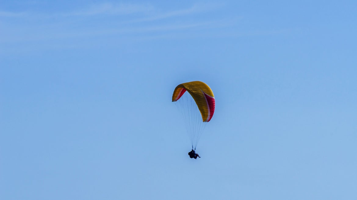 Paraglider flying in the sky free time spent actively wonderful experiences vacation, active sport