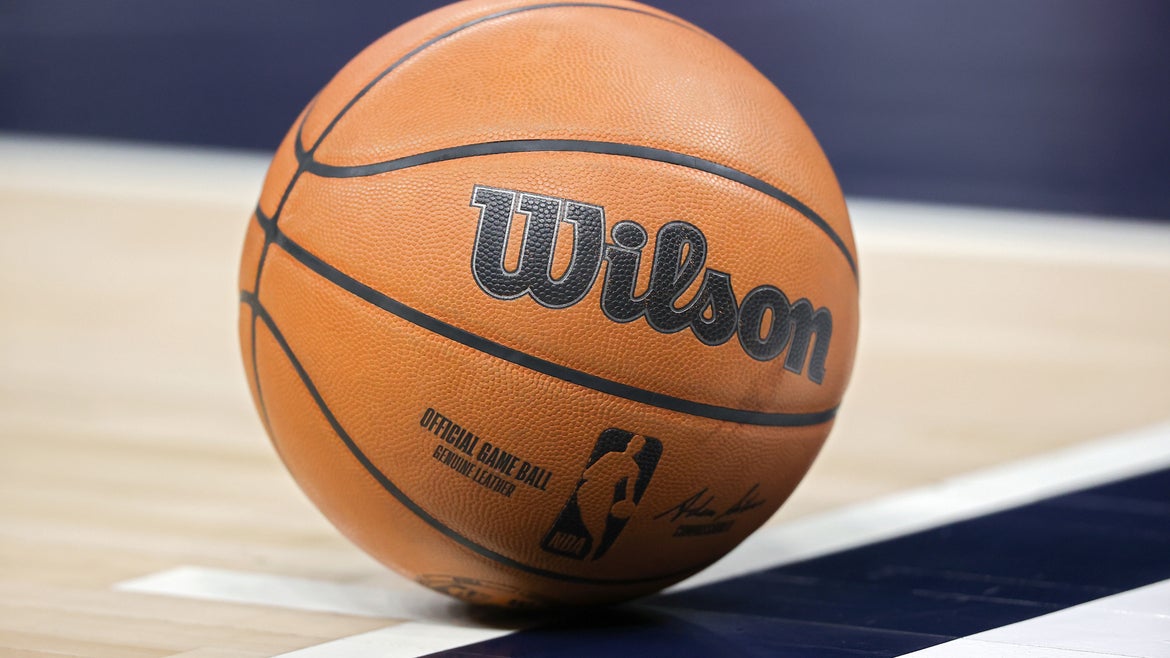 A fan was hit by a basketball, similar to the one pictured above.