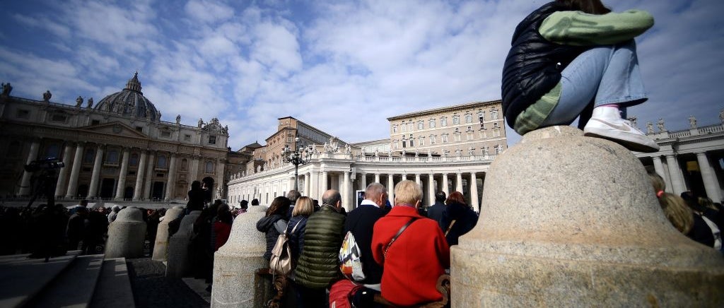 Crowd standing in front of Vatican