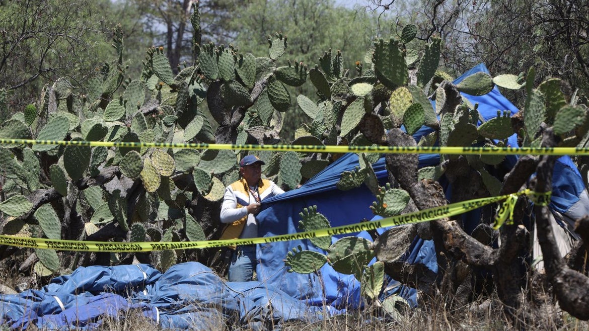 National Guard and Experts investigate the crash area, where a hot air balloon caught fire in mid-flight in the Teotihuacan archaeological zone