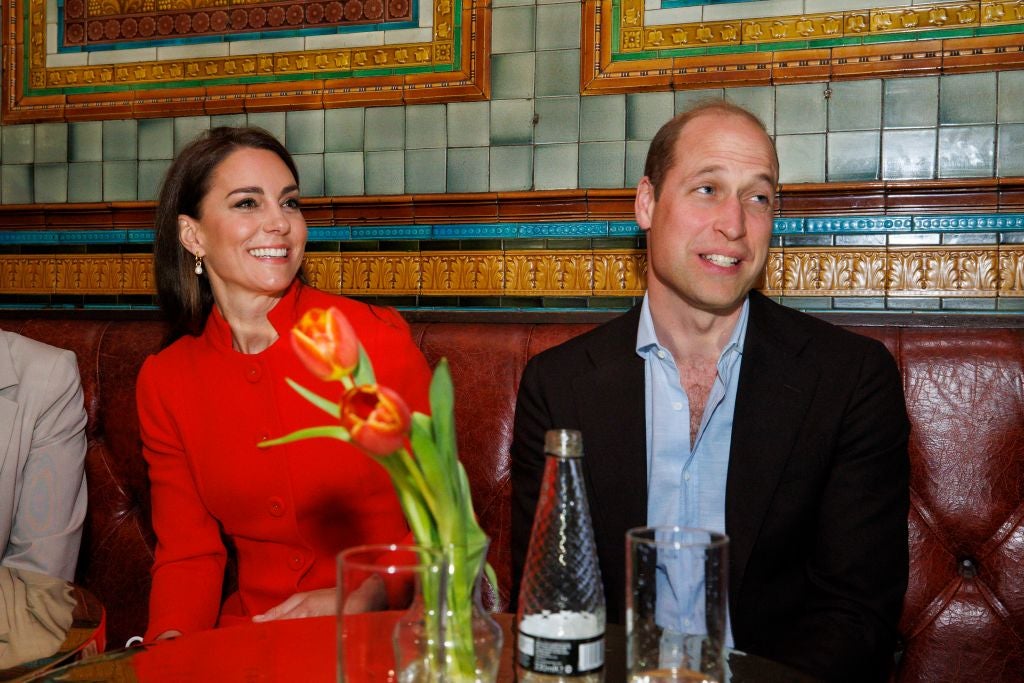 Prince William, Prince of Wales and Catherine, Princess of Wales chat to local business people as they visit the Dog and Duck pub in Soho ahead of this weekend's coronation on May 4, 2023 in London, England.