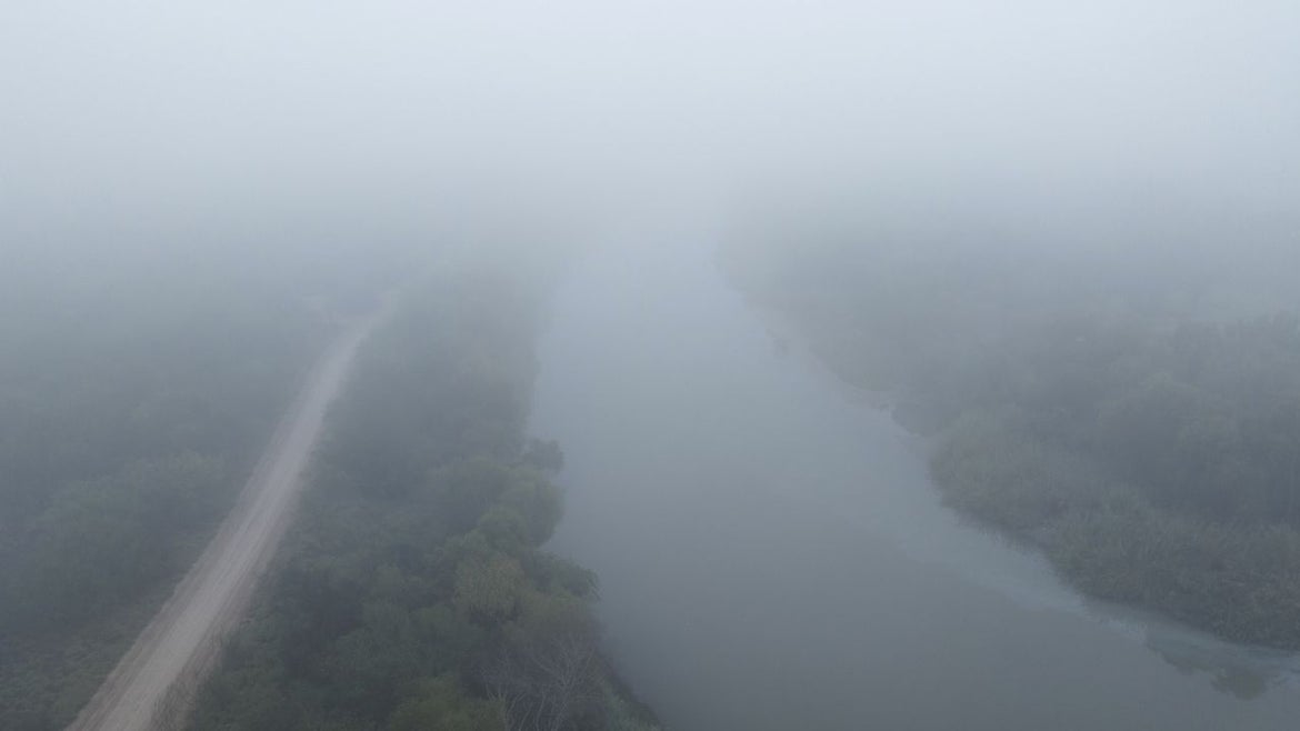 The Rio Grande flows through the fog towards the Gulf of Mexico on December 3, 2022 in Reynosa, Mexico. 