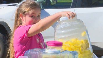 Little girl pouring lemonade