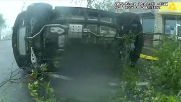 A woman trapped in her overturned SUV was able to walk away after an EF2 tornado swept through Slidell, Louisiana.