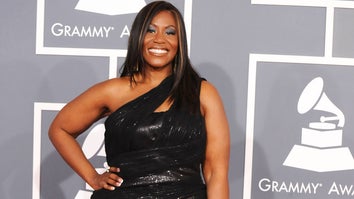 Mandisa on the red carpet at the Grammys in a black dress.