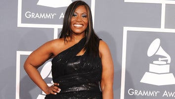 Mandisa on the red carpet at the Grammys in a black dress.