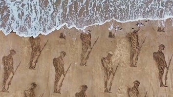Soldiers stenciled into sand