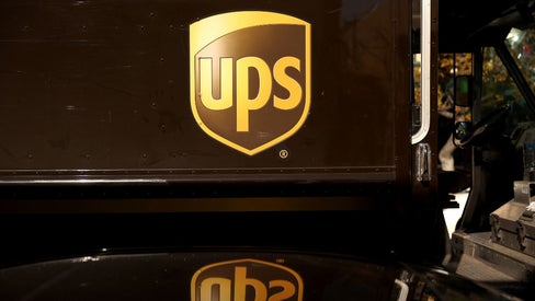 The United Parcel Service (UPS) logo is displayed on a delivery truck