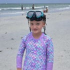 8-year-old Josie wearing purple swim suit