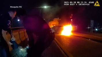 Cops pull woman away from burning car