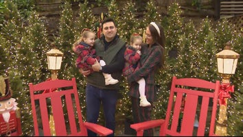 Family surrounded by Christmas decorations