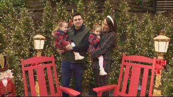 Family surrounded by Christmas decorations