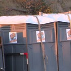 Truck Hauling Porta Potties