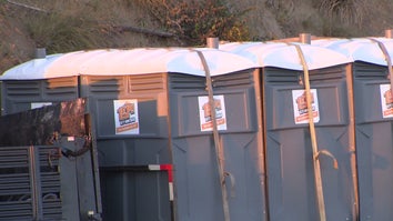 Truck Hauling Porta Potties