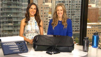Two women standing behind a table displaying a Cutlery Set, Vibration Machine, Water Bottles