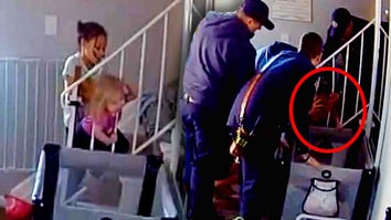 Child with head stuck between two banisters / A team of firefighters trying to pull on banister to free child