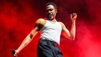 Donald Glover, AKA Childish Gambino, performing in front of red background in Los Angeles