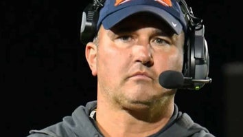 Travis Turner wearing a headset while coaching