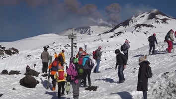 Skiers On Mount Etna During Eruption 