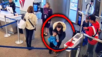Airport terminal with a woman and child circled 