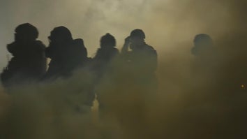 People wearing gas masks