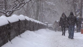 People walking in a snowstorm