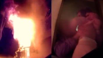 Flames, child held out window