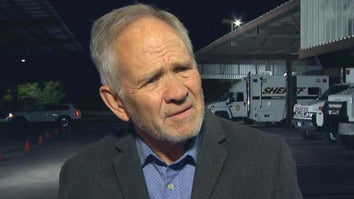 Ed Smart speaking to an interviewer outside at night