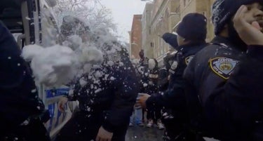 Uproar After NYPD Cops Hit With Snowballs By Massive Crowd