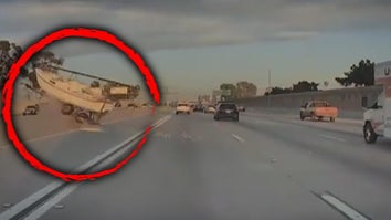 Boat going over divider on highway