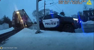 Bodycam Captures Cop Rescuing Woman Off Trains Tracks As Locomotive Arrives