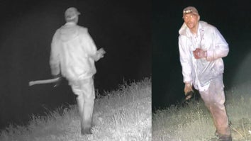 Surveillance from a trail camera depicting a man in white coveralls, holding an axe
