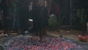 Devotees of Hindu God Ayyappa Walk Over Hot Embers During Ceremony