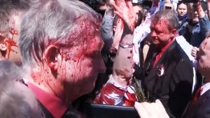 Ukraine Supporters Throw Red Paint on Russian Ambassador at Poland Cemetery