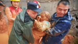 Firefighters Rescue Woman Buried in Mud After Rain Causes Landslide in China