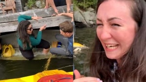 Woman Holds Onto Dock as Canoe Tips Over and Onlookers Laugh in Canada