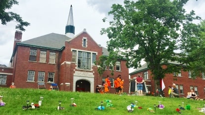 Stuffed animals were placed in front of the former Kamloops Residential School Monday in a community vigil that encouraged attendees to wear orange, a Canadian tradition that aims to raise awareness for the atrocities of residential schools.