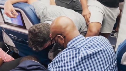 Passenger being restrained on a flight