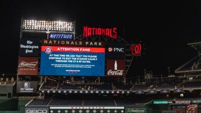 Digital sign in the Padres and Nationals' game that asks fans to exit slowly